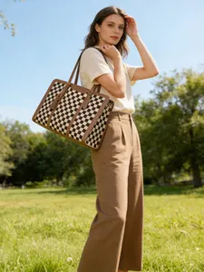 Stylish checkered tote bag with brown leather trim, casual shoulder handbag for daily use.