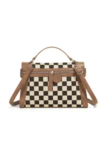 Chic black and white checkerboard pattern handbag with brown leather trim and shoulder strap.