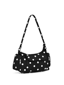 Close-up view of black nylon polka dot hobo shoulder bag detail, multi-pocket stylish design.