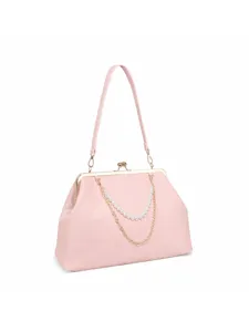 Charming pink kisslock handbag featuring elegant pearl chain detail and gold tone hardware.
