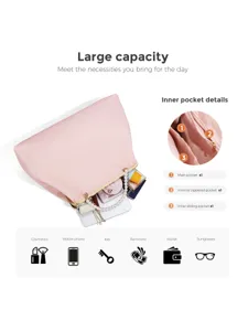 Detailed view of pink kisslock handbag showing large capacity and interior pocket design.