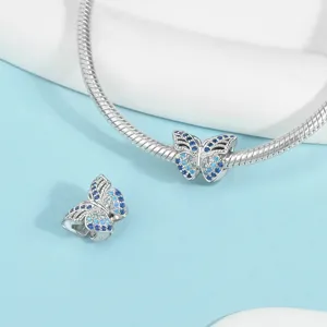 Silver snake chain with blue crystal butterfly charms, detailed sparkling cubic zirconia inlay.