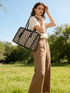 Stylish black and white checkered tote bag for women, elegant shoulder handbag for daily use.