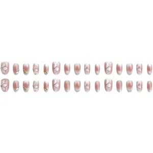 Nude roze verloop druknagels met elegante 3D zilveren bloemenkunst en sprankelende strass-steentjes.