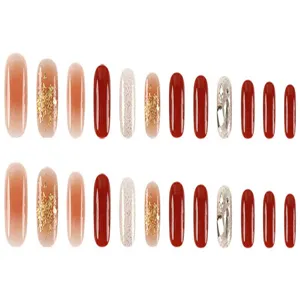 Set de uñas postizas con brillantes strass, hoja de oro y hermosos diseños rojos.