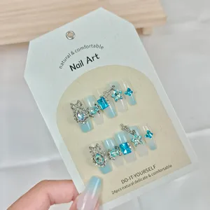 Uñas postizas degradadas azules con diamantes de imitación y estrellas, set de 24 piezas.