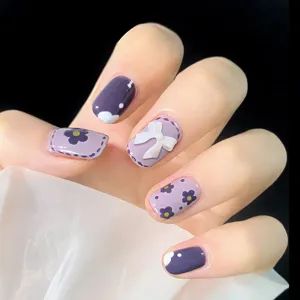 Uñas postizas hechas a mano con lazo 3D blanco y diseño floral morado, set de manicura elegante.