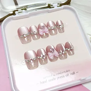 Uñas postizas hechas a mano largas rosas ojo de gato con diamantes brillantes y lazo