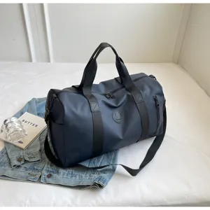 Waterproof travel duffel bag for men, large capacity gym sport bag with shoulder strap.
