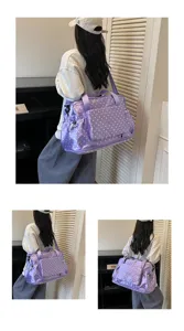 Purple polka dot travel duffel bag, large capacity foldable shoulder bag for sports trips.