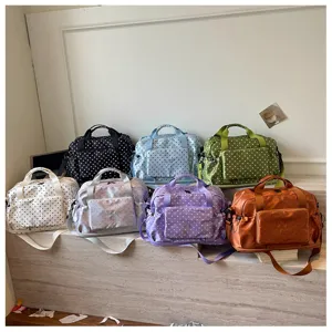 Polka dot travel duffel bag detail showcase, multi-color large capacity gym luggage bag.