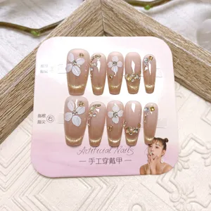 Uñas postizas hechas a mano con flores blancas y diseño ojo de gato francés, 10 pzas.