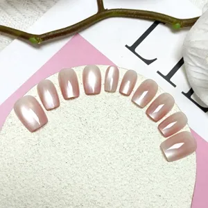 Cat eye press on nails detail view, gradient light pink fake nail tips display for elegant manicure.