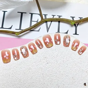 Handmade short square press-on nails featuring 3D tulip art and sparkling cat eye details.