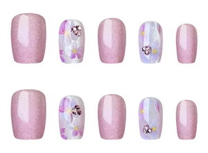 Set de uñas postizas efecto ojo de gato rosa con arte floral y diamantes, estilo elegante.