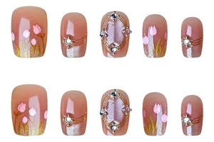 Detailed view of handmade tulip press on nails with cat eye effect and crystal rhinestones.