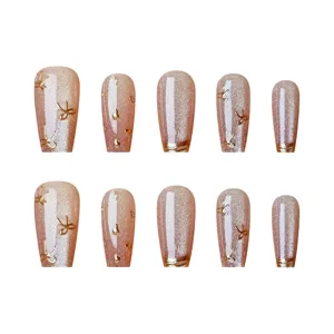 Uñas postizas largas con lazos de oro 3D ojo de gato set de manicura vista principal