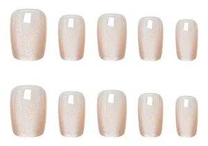 Nude pink pearl cat-eye press-on nails, short trapezoid fake nail art details and texture closeup.