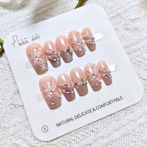 Uñas postizas rosa con mariposa ojo de gato, manicura artesanal dulce detalles.