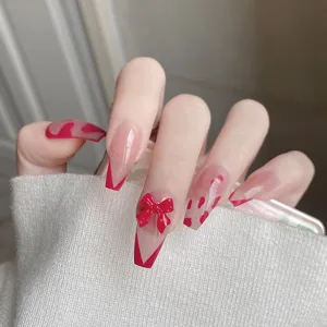 Uñas postizas hechas a mano ataúd largo con lazo rojo y bonito diseño francés
