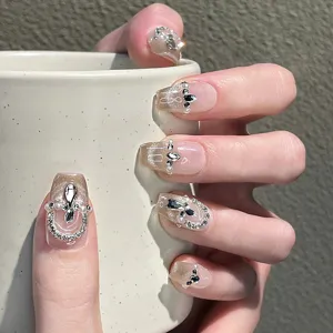 Uñas postizas hechas a mano con purpurina efecto ojo de gato y pedrería, 10 piezas.