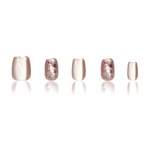 Short trapezoid press-on nails featuring cat-eye effect and pink glitter for daily wear.