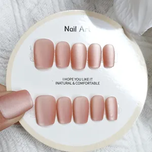 Detailed close-up of 10pcs matte pink ballerina press-on nails on display card, elegant.