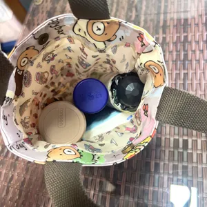 Waterproof portable cartoon cup bag and small tote handbag for women, daily utility.