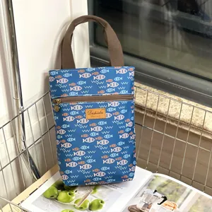 Waterproof cute fish print handbag, durable canvas material with front zipper pocket for daily use.