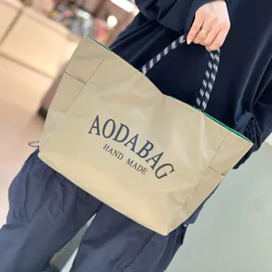 Casual beige canvas tote bag with contrast handle, large capacity daily shoulder bag for women.