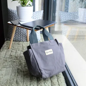 Grey canvas lunch tote bag, casual daily handbag and large diaper bag detail view.