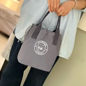 Waterproof drawstring lunch bag portable insulated bucket handbag for daily commuting office use.