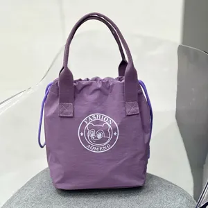 Purple waterproof drawstring tote bag for lunch, casual commute handbag and daily storage.