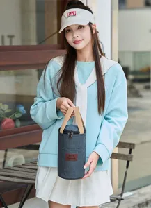 Detail view of portable cylinder insulated bento bag with durable handles for daily use.