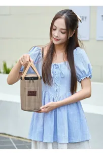 Portable insulated cylinder lunch bag with striped design and sturdy handle for daily use.