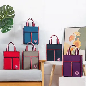 Insulated lunch bag for office workers and students, thick aluminum foil bento tote in various colors.