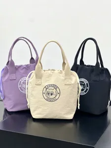 Detail view of waterproof canvas drawstring tote bag with cute bear logo for daily lunch.