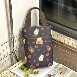 Cute waterproof cartoon bear print handbag, versatile portable tote bag for cups and items.