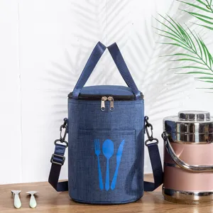 Round insulated lunch bag with shoulder strap, waterproof bento tote for daily meal prep.