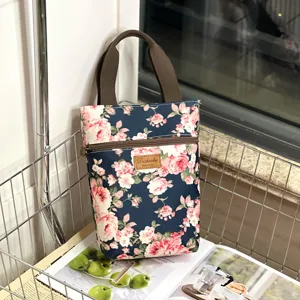 Waterproof floral handbag stylish shoulder tote daily cup bag with secure zipper closure handles.