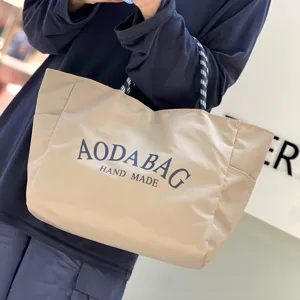 Minimalist large capacity canvas tote bag with letter print for daily commute shopping