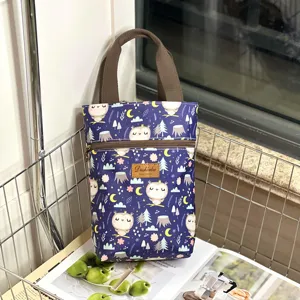Waterproof owl print handbag, detailed view of durable fabric tote bag with secure zipper closure.