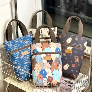 Detailed view of waterproof cartoon handbag with zipper pocket and cute animal prints.