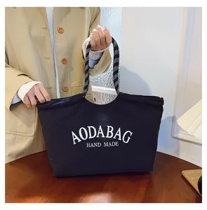 Grote casual canvas shopper tas met stijlvolle letteropdruk voor werk en dagelijks gebruik.