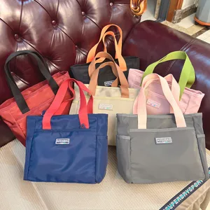 Korean style color-blocked canvas handbag, multi-pocket commuting lunch bag and tote.