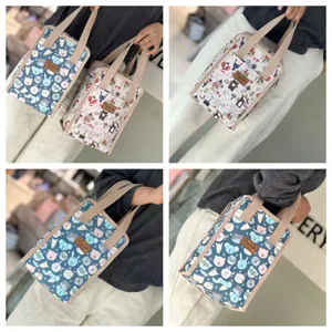 Detailed view of insulated lunch bag with cute animal prints, portable bento bag for daily use.