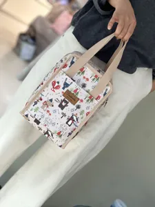 Waterproof insulated lunch bag with cute cartoon animal print for office school daily use.