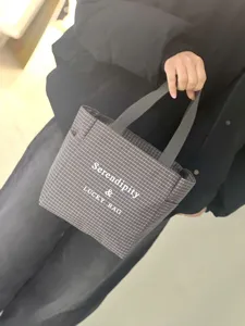 Detail view of the canvas plaid tote bag with letter print, casual commuter handbag close-up