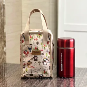 Waterproof insulated lunch bag with cute cartoon animal print, portable bento tote for work.