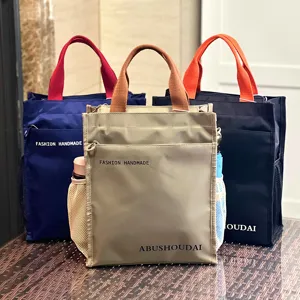 Multi-layer canvas tote bag with contrast handles, large capacity commuter student handbag.
